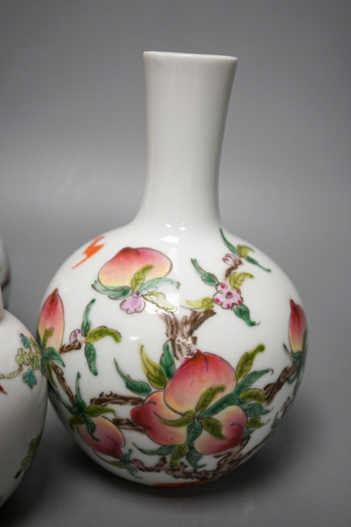 A pair of Chinese famille rose ‘peach’ bottle vases, 17cm, a ‘phoenix’ jar and cover, two porcelain cups and a boxed set of bamboo tallies or counters (6)